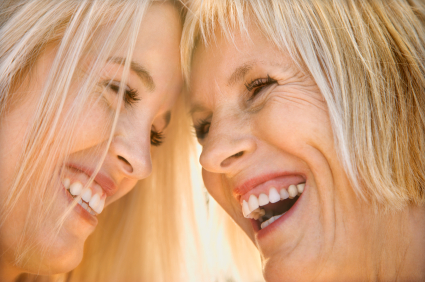 Mom and daughter laughing.